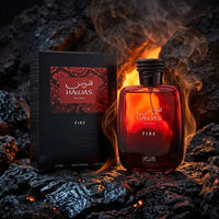 Hawas For Him Fire perfume bottle and packaging on black coals with visible flames