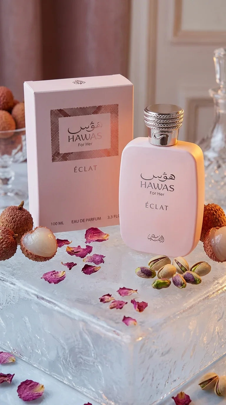 Hawas for Her Éclat perfume bottle and box on ice with lychees, pistachios, and rose petals