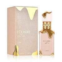 Eclaire perfume bottle with gold accents and matching gold-trimmed box, 100ml luxury fragrance.