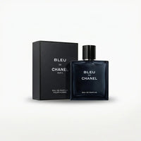 Blue square glass perfume bottle and matching box on white background, luxury fragrance for men