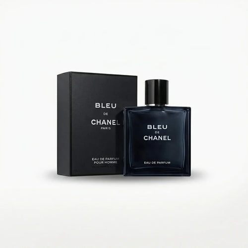 Blue square glass perfume bottle and matching box on white background, luxury fragrance for men