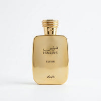 Gold Hawas Elixir perfume bottle with Arabic script on a white background