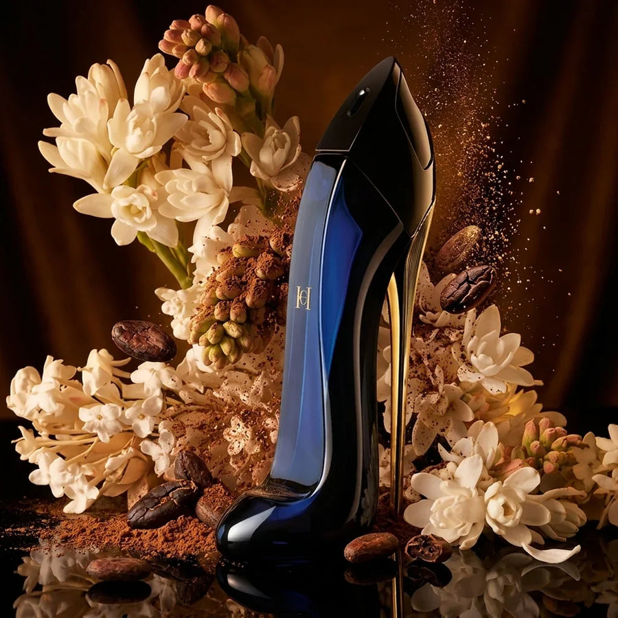 Elegant stiletto-shaped perfume bottle with white flowers, cocoa beans, and coffee accents