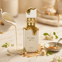 Eclaire Lattafa perfume bottle with gold accents, surrounded by milk, caramel, and white flowers.