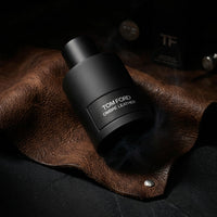 Certificate of authenticity with red wax seal for genuine luxury perfume product.