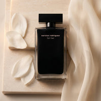 Certificate of authenticity with red wax seal for genuine luxury perfume product.
